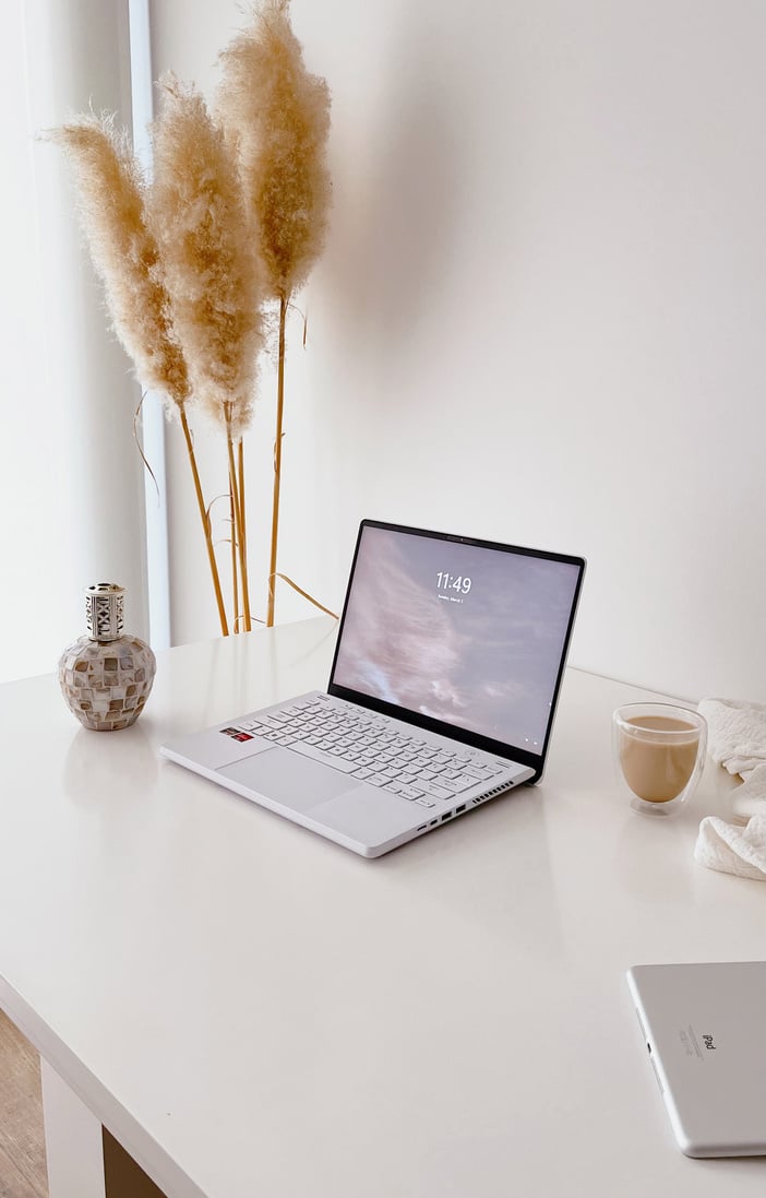 Laptop on white desktop